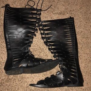 Knee length gladiator style shoes